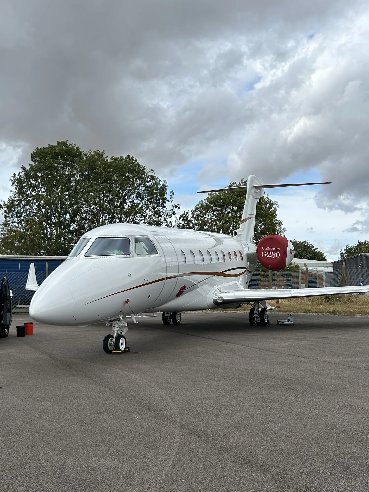 Gulfstream G280 private jet after a full exterior valet, parked on the ramp