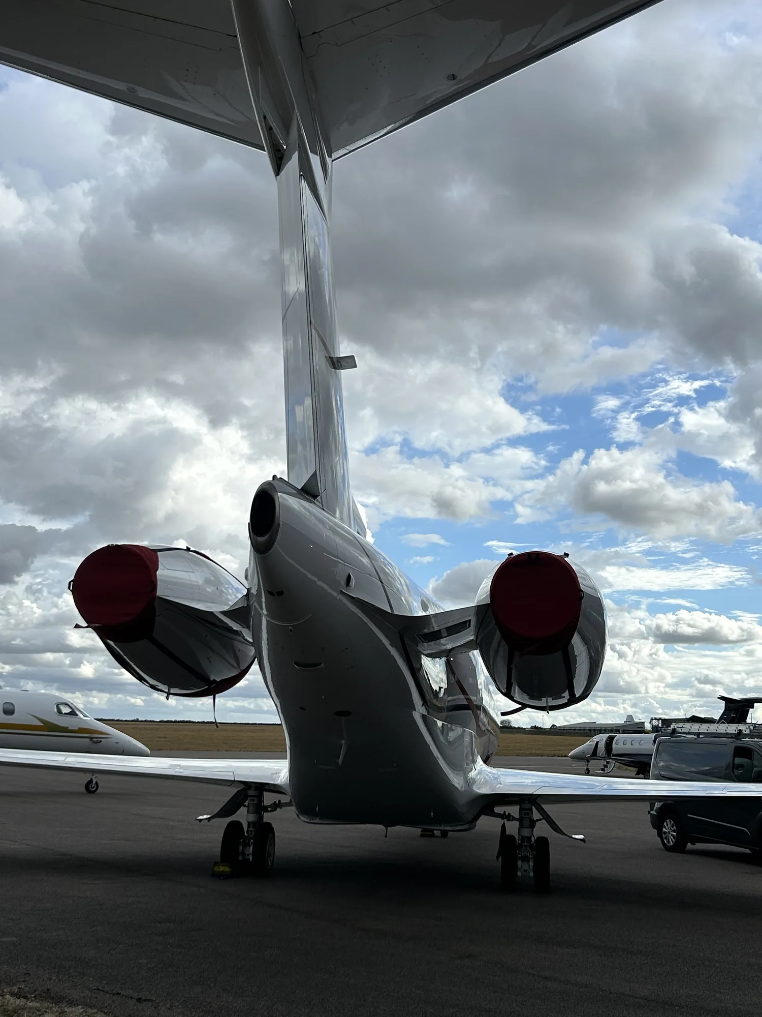 Rear view of a Gulfstream G280 tail and engines after a full exterior clean