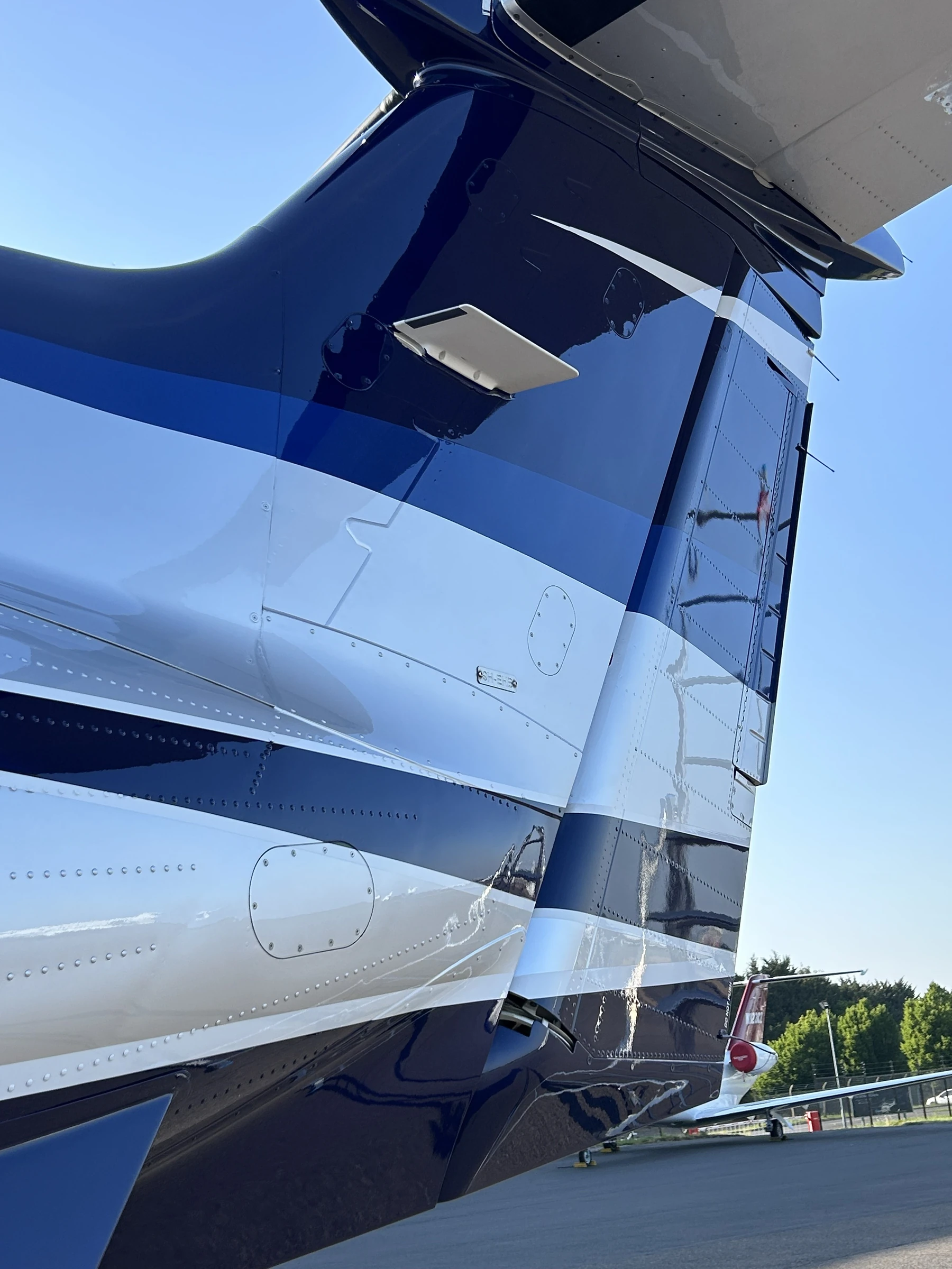 Private jet aircraft valeting UK - mirror finish tail after professional detailing