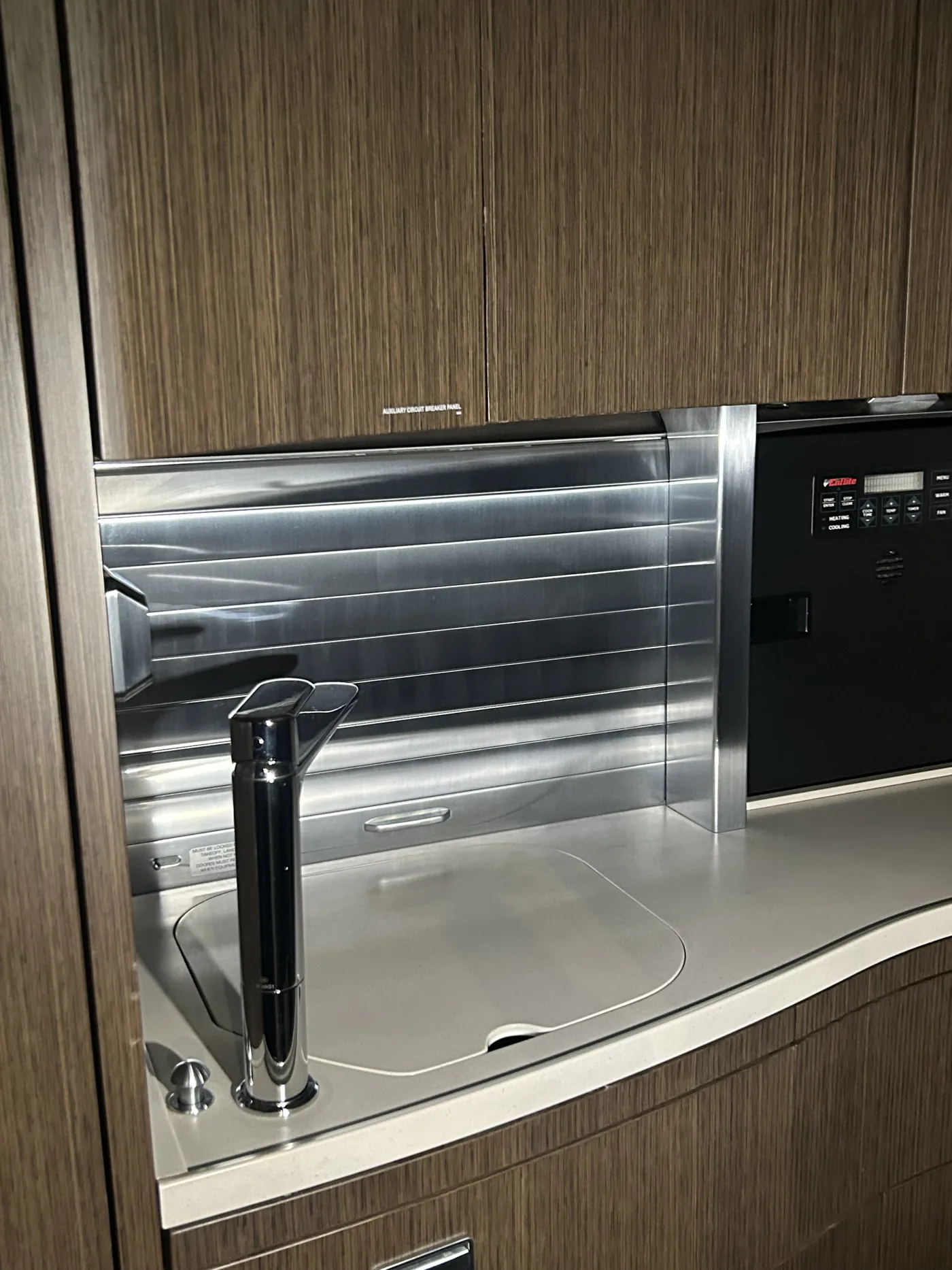 Aircraft galley with polished stainless steel surfaces after a deep clean